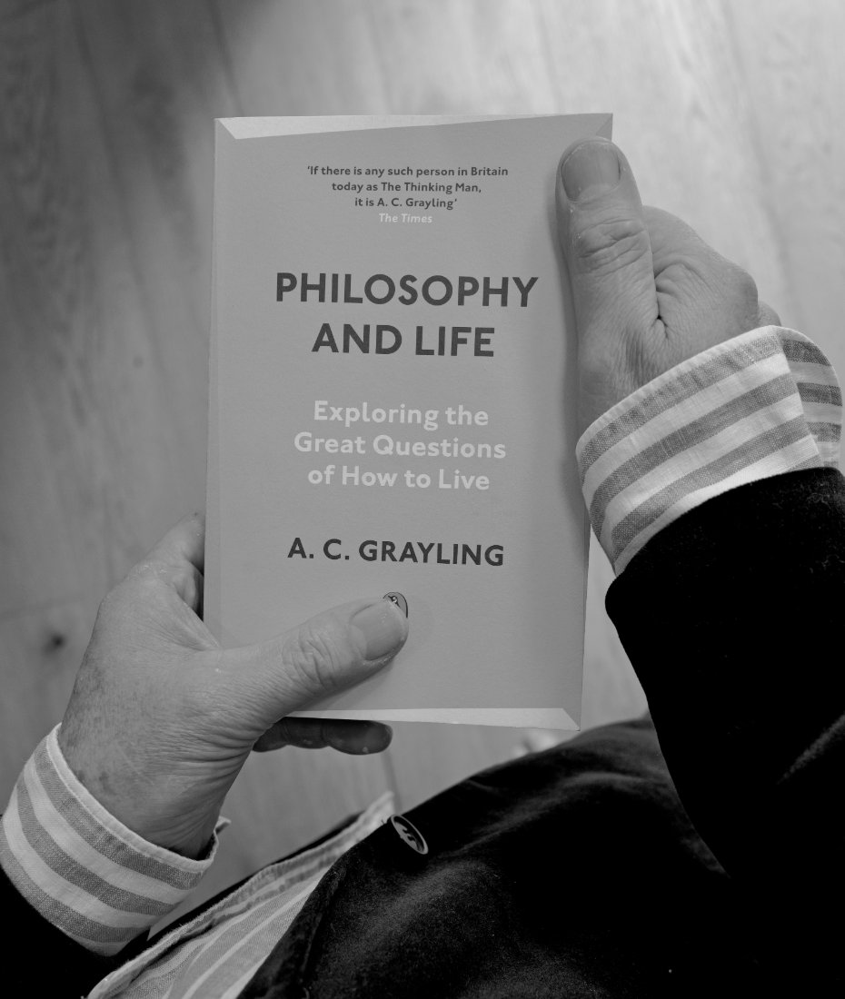 A.C. Grayling holding his book, Philosophy and Life